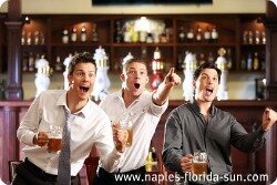 naples sports bars, guys watching sports, guys at a sports bar, men drinking beer